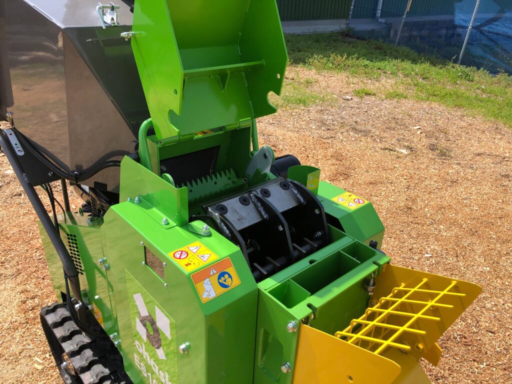 Detail photo of the blades and opening of an Ohashi ES101GH 4-inch Compact tracked woodchipper
