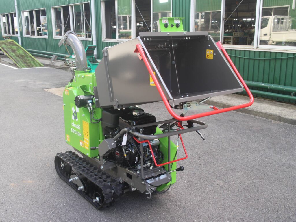 Photo of the back of an Ohashi ES131GH 5-inch compact tracked Woodchipper in a factory