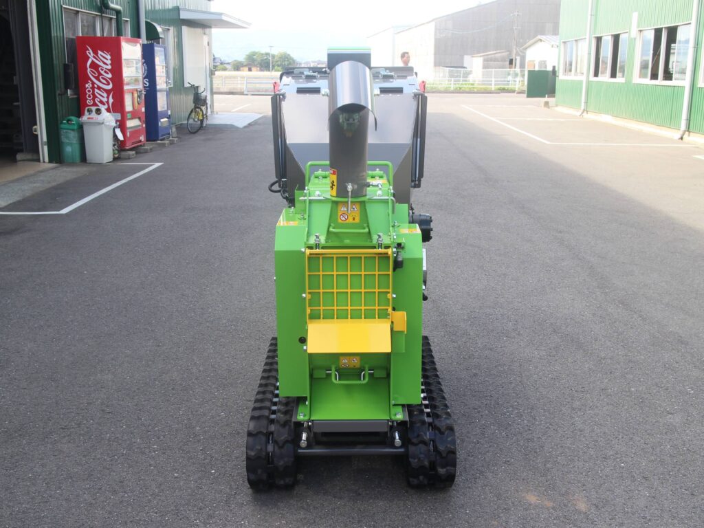 Photo of the front of an ES131GH 5-inch compact tracked woodchipper in a factory