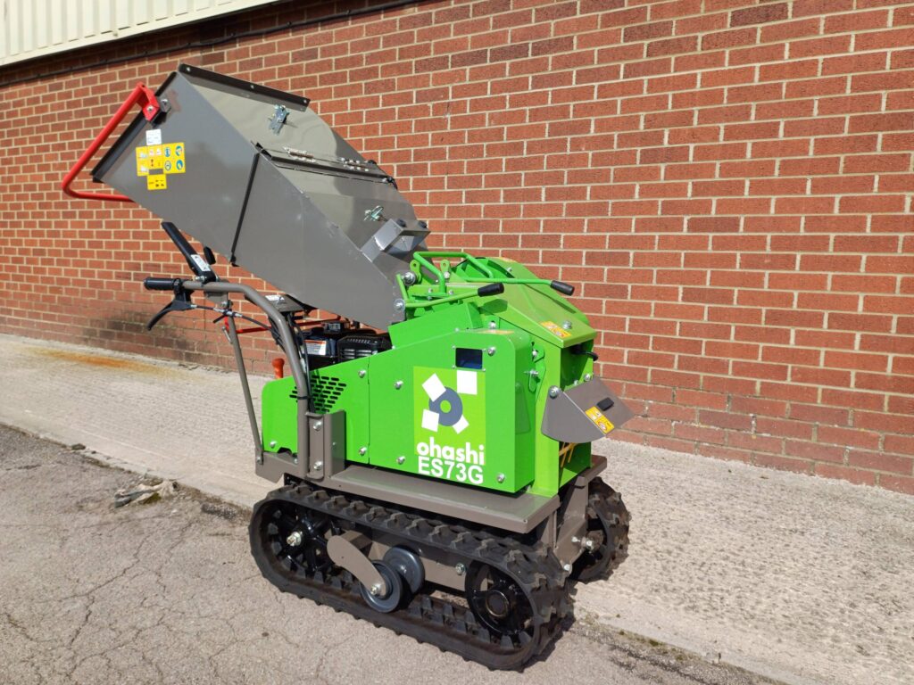 Photo of Ohashi ES73G 3-inch Compact tracked woodchipper with brick wall background
